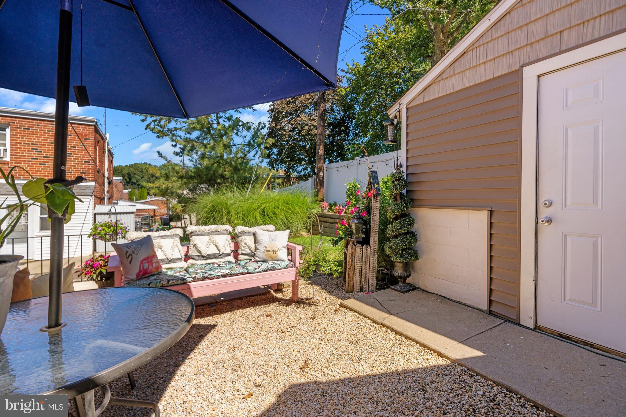 809 Millwood Road Philadelphia, PA 19115 - Photo 22 of 22 a view of a backyard with a patio