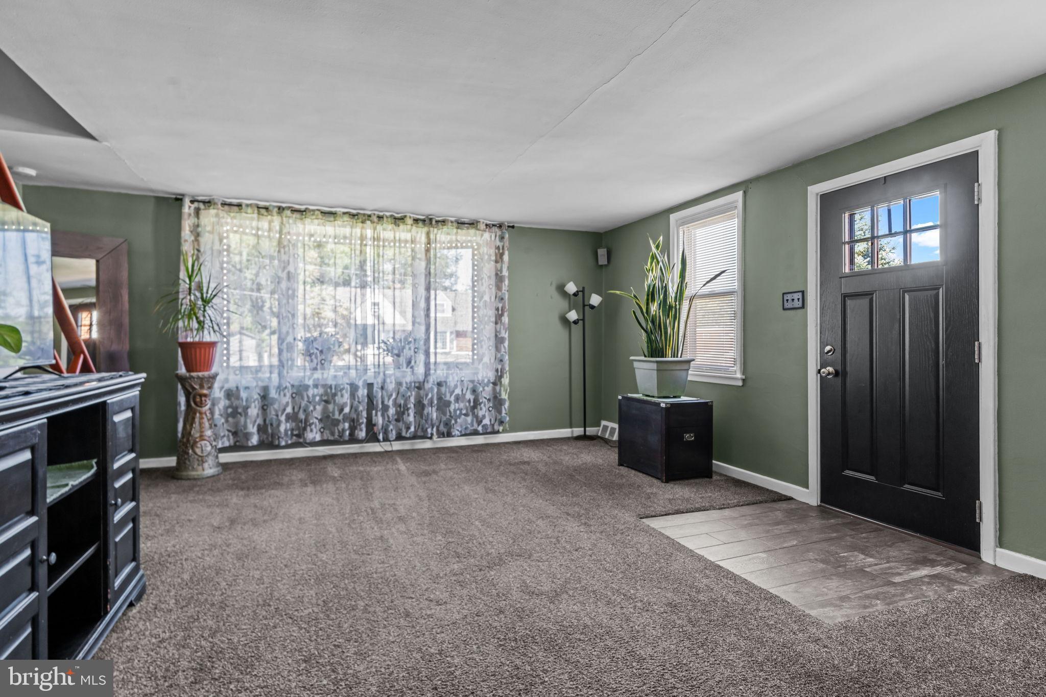 809 Millwood Road Philadelphia, PA 19115 - Photo 5 of 22 a view of an empty room with furniture and a window