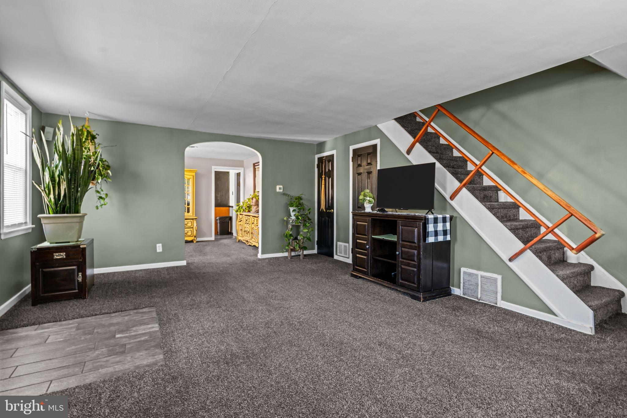 809 Millwood Road Philadelphia, PA 19115 - Photo 6 of 22 a view of a livingroom with furniture and a flat screen tv