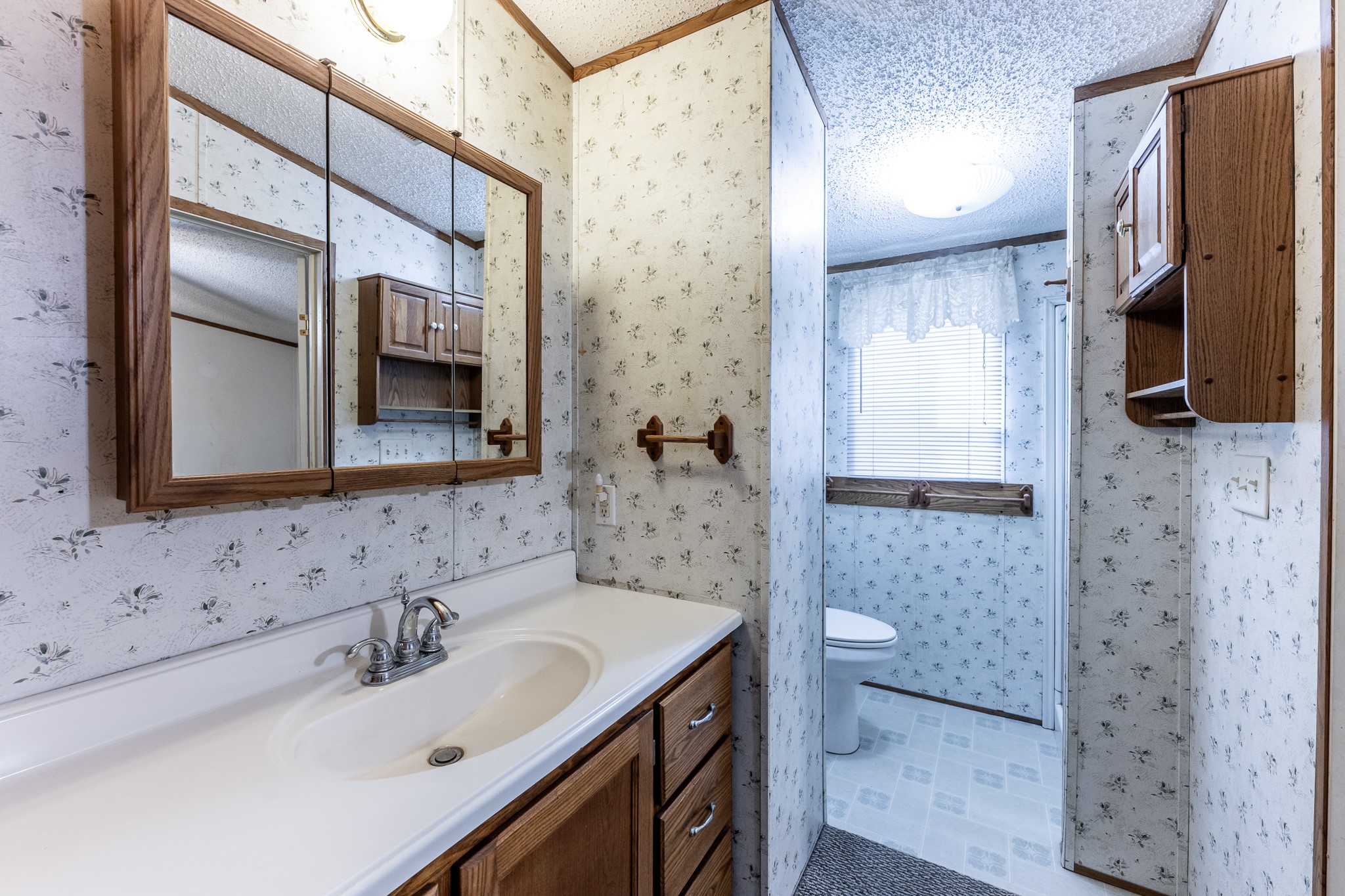 400 Marina Drive Trinity, TX 75862 - Photo 13 of 25 a bathroom with a sink a toilet and shower