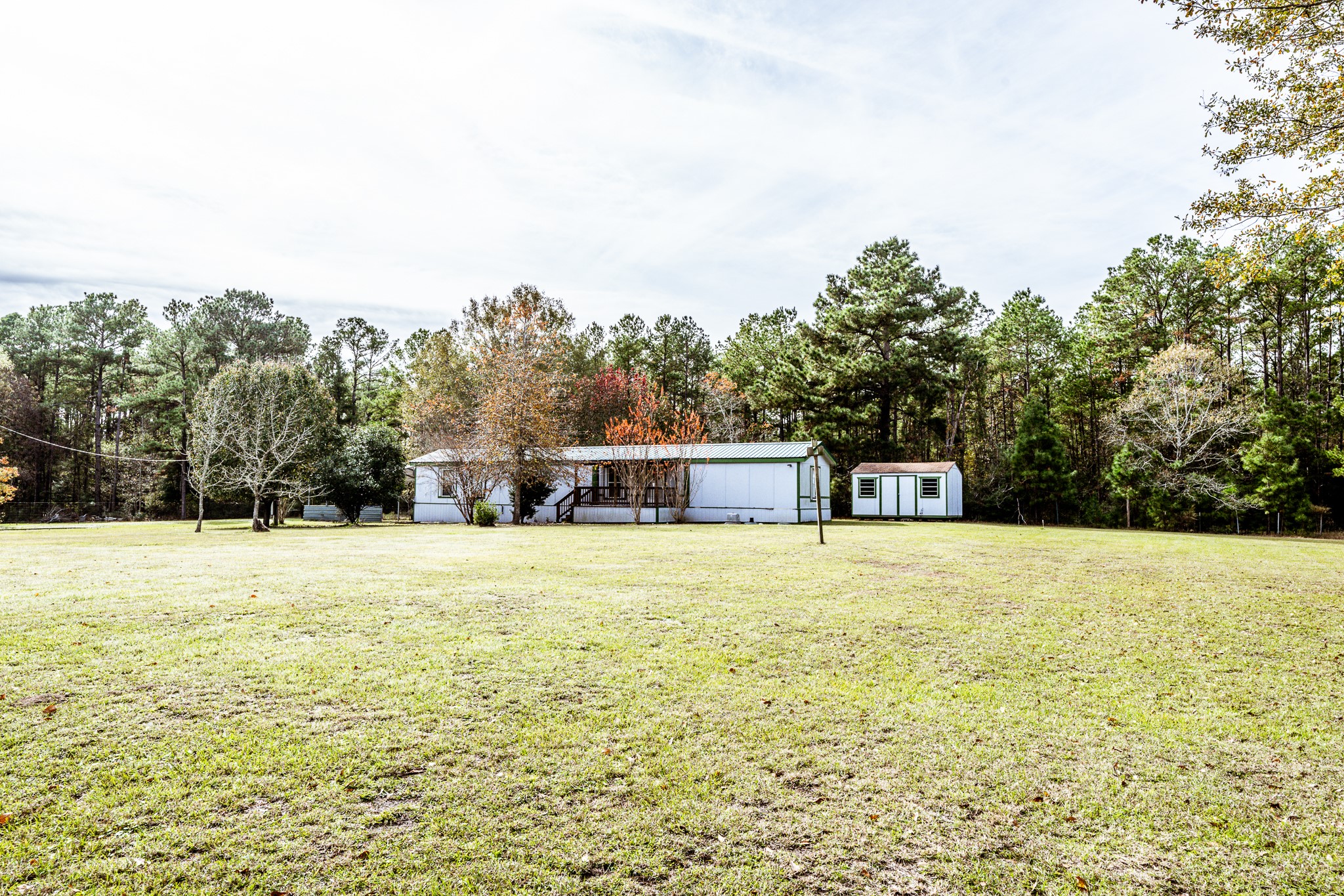 400 Marina Drive Trinity, TX 75862 - Photo 20 of 25 a house with trees in front of it