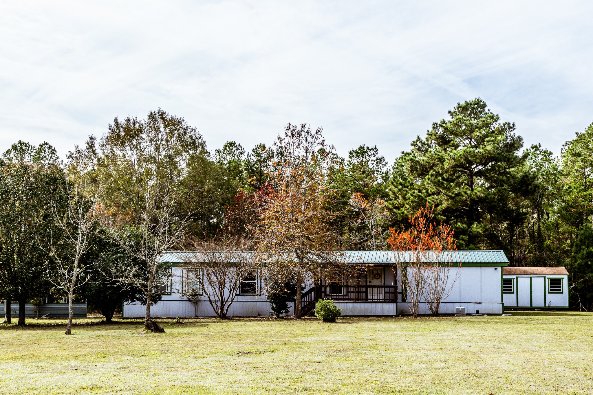 400 Marina Drive Trinity, TX 75862 - Photo 2 of 25 a view of a house with swimming pool and next to a yard