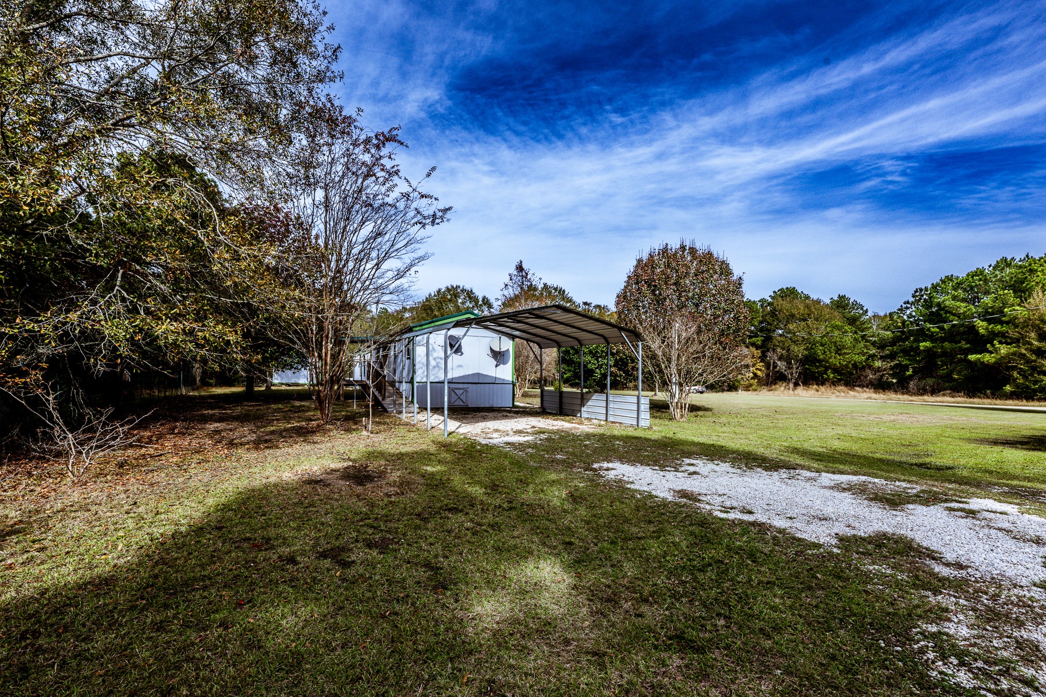 400 Marina Drive Trinity, TX 75862 - Photo 22 of 25 a front view of a house with a yard
