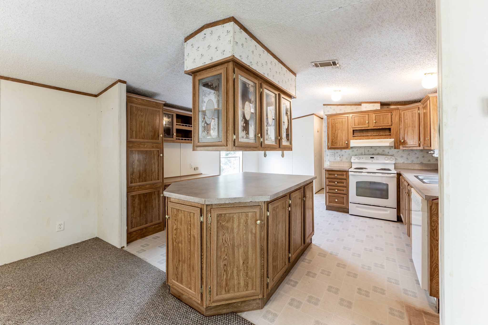 400 Marina Drive Trinity, TX 75862 - Photo 6 of 25 a kitchen with stainless steel appliances granite countertop a stove a sink and a refrigerator