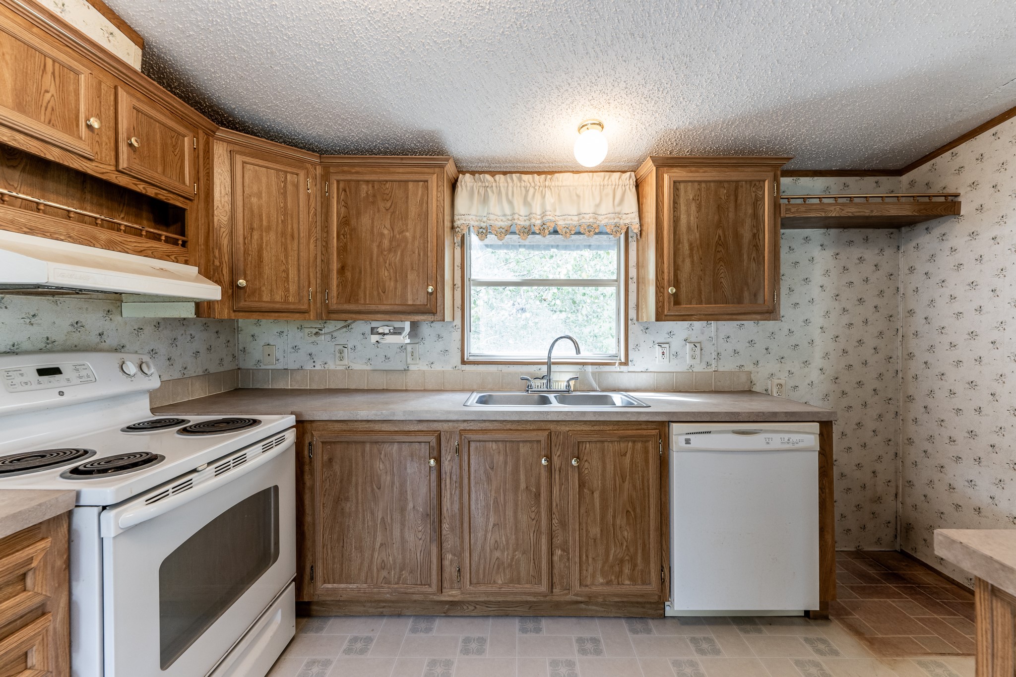 400 Marina Drive Trinity, TX 75862 - Photo 8 of 25 a kitchen with a sink stove and cabinets