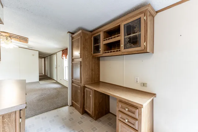 a view of a big room with closet and chandelier fan