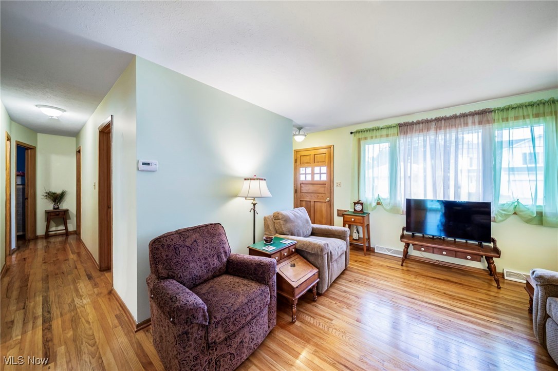 30888 Harrison Road Wickliffe, OH 44092 - Photo 7 of 33 Living area featuring wood finished floors and baseboards
