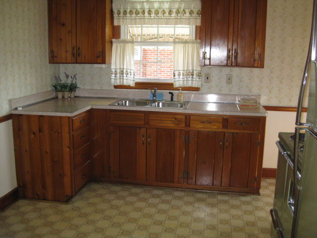 4656 Elva Road Northwest Roanoke, VA 24017 - Photo 3 of 10 a kitchen with a sink cabinets and window