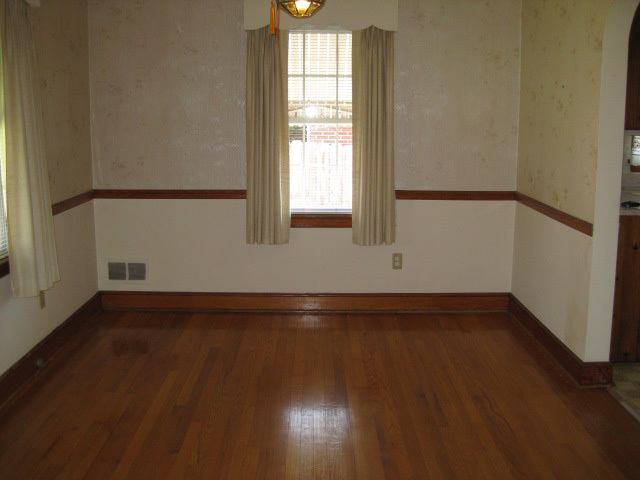 4656 Elva Road Northwest Roanoke, VA 24017 - Photo 5 of 10 an empty room with wooden floor and windows