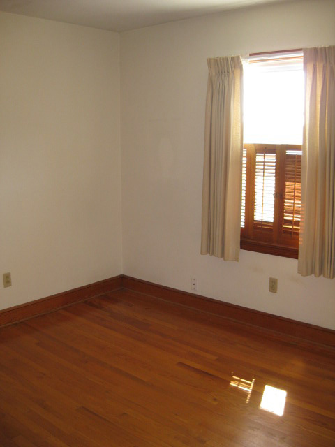 4656 Elva Road Northwest Roanoke, VA 24017 - Photo 9 of 10 an empty room with wooden floor and windows
