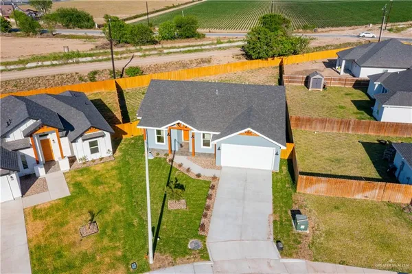 an aerial view of a house with a ocean view