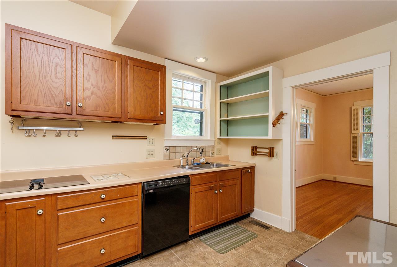 311 Hillcrest Road Raleigh, NC 27605 - Photo 13 of 30 a kitchen with a sink and cabinets