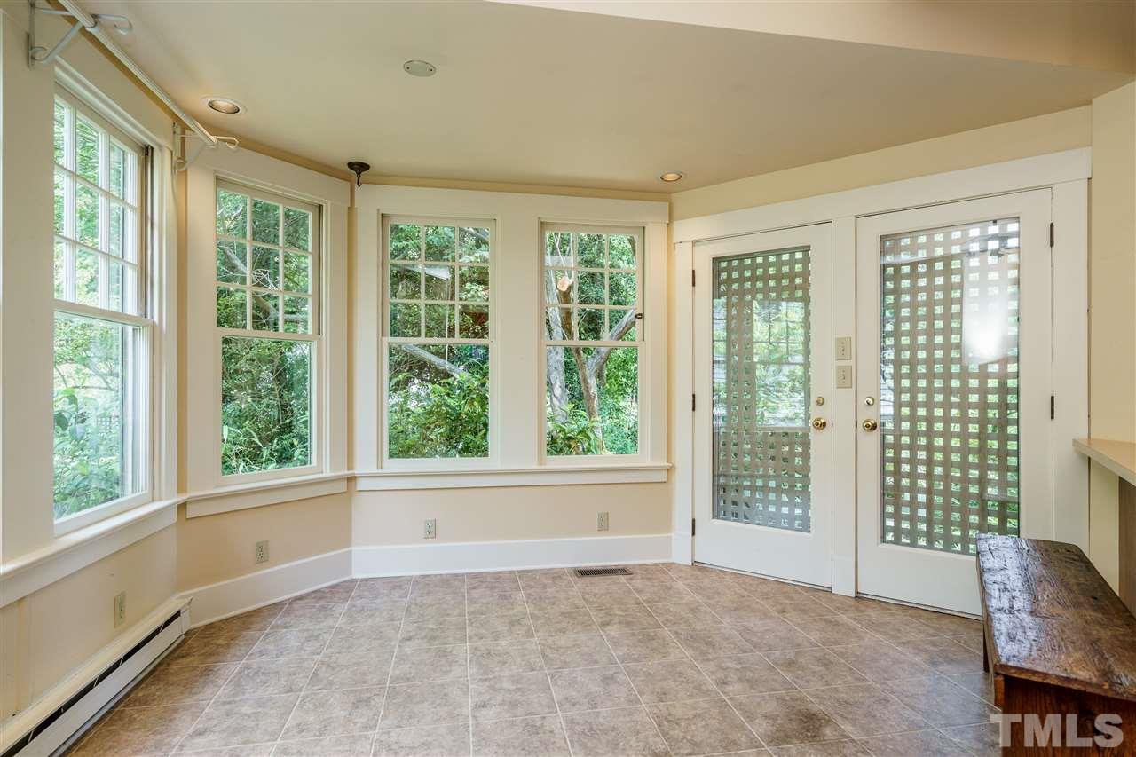 311 Hillcrest Road Raleigh, NC 27605 - Photo 15 of 30 a view of an empty room with a window