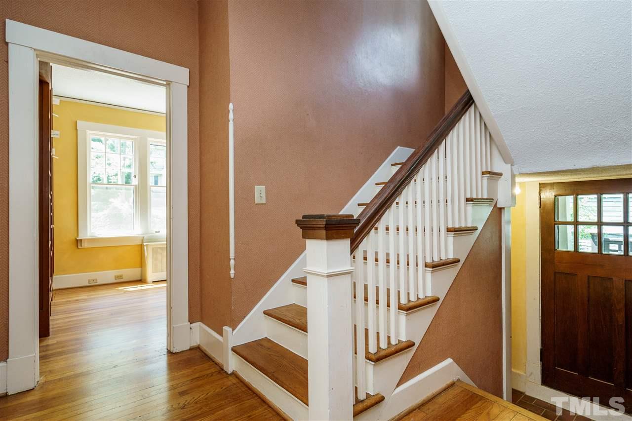 311 Hillcrest Road Raleigh, NC 27605 - Photo 19 of 30 a view of an entryway with wooden floor and door