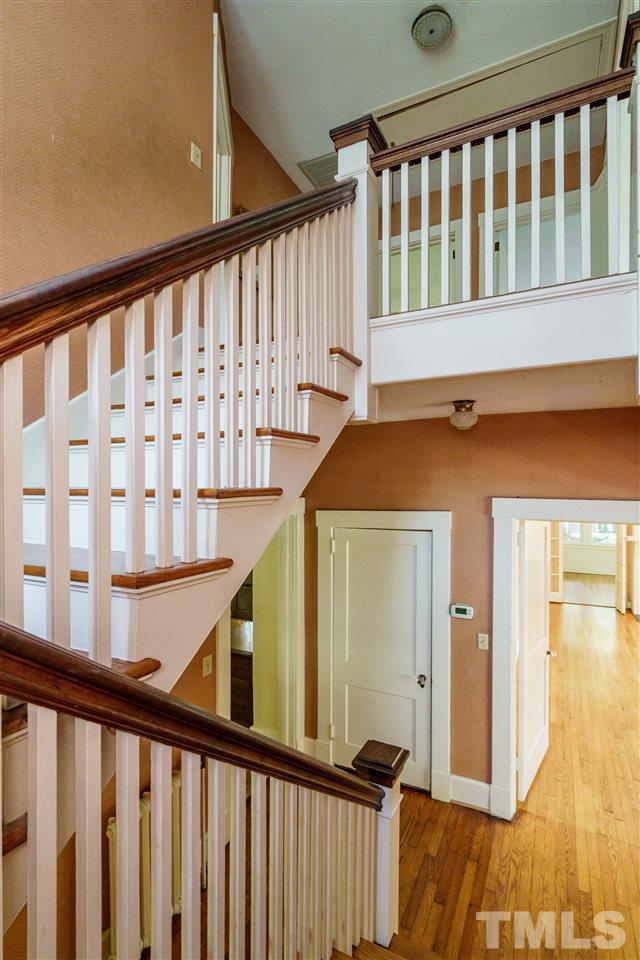 311 Hillcrest Road Raleigh, NC 27605 - Photo 20 of 30 a view of staircase with railing and a window
