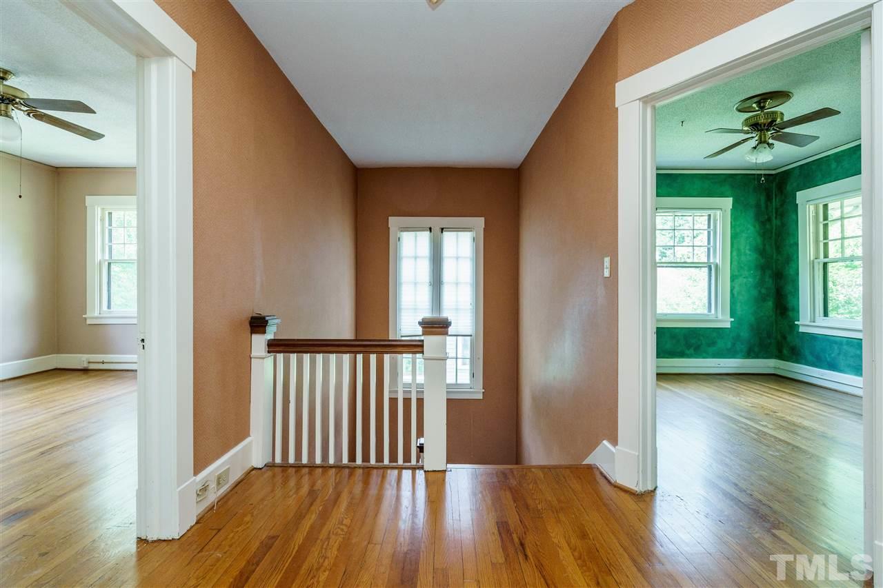 311 Hillcrest Road Raleigh, NC 27605 - Photo 21 of 30 a view of a hallway view with wooden floor and staircase