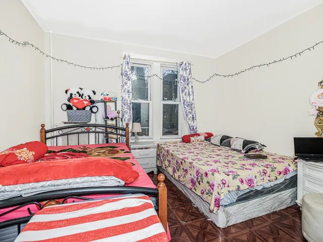 a bedroom that has a bed and a table in it