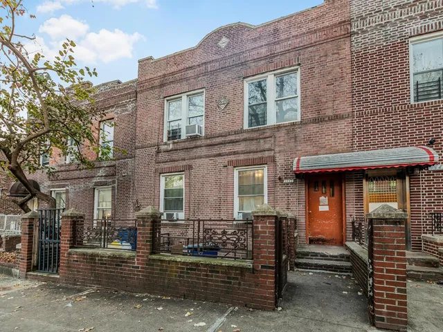 a front view of a house with glass windows