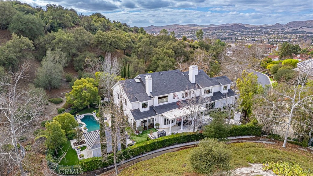 an aerial view of residential houses with outdoor space and river