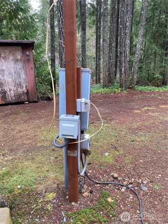 a view of a backyard with chairs