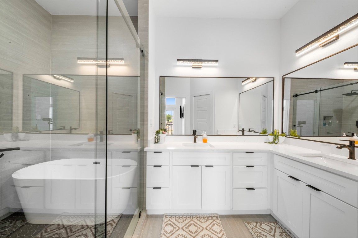 6815 Paris Street Houston, TX 77021 - Photo 12 of 30 a spacious bathroom with a shower sink mirror and double