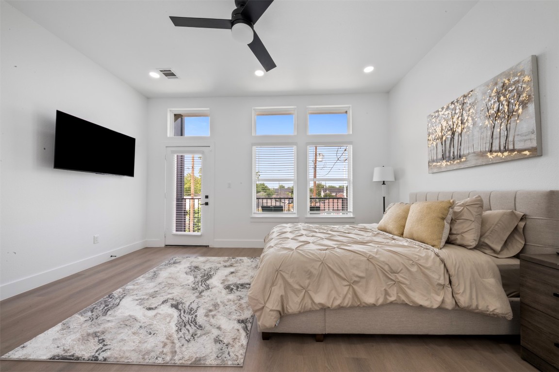 6815 Paris Street Houston, TX 77021 - Photo 14 of 30 a spacious bedroom with a bed and a flat screen tv