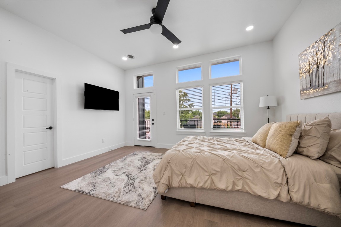 6815 Paris Street Houston, TX 77021 - Photo 15 of 30 a spacious bedroom with a bed and a flat screen tv