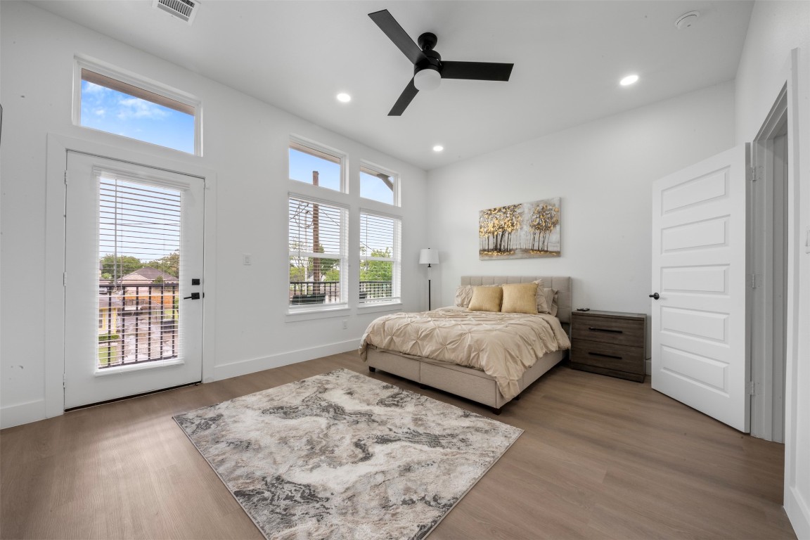 6815 Paris Street Houston, TX 77021 - Photo 16 of 30 a bedroom with a large bed and a window