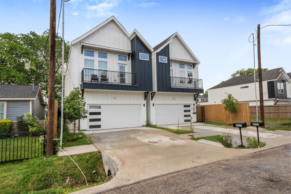 6815 Paris Street Houston, TX 77021 - Photo 2 of 30 a front view of a house with a garden and garage