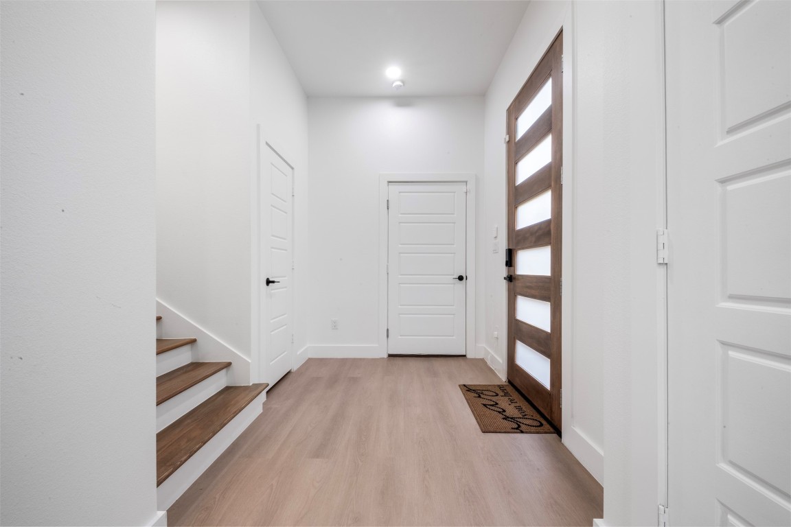 6815 Paris Street Houston, TX 77021 - Photo 10 of 30 a view of utility room with closet and wooden floor
