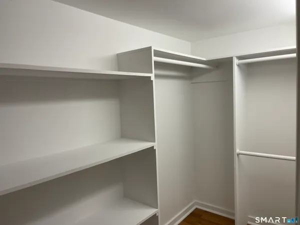 a view of an empty walk in closet