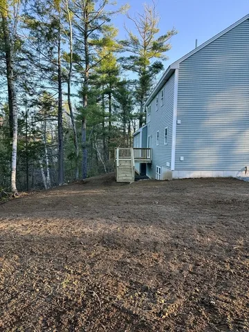 a view of a house with a tree