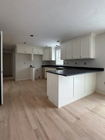 a view of cabinets and wooden floor