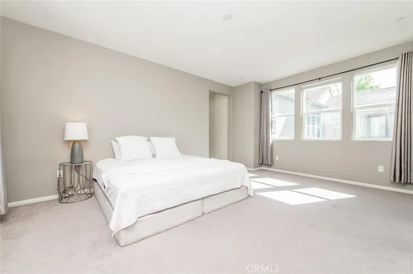 a spacious bathroom with a shower sink and mirror