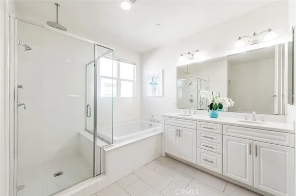 a bathroom with a sink vanity and a mirror