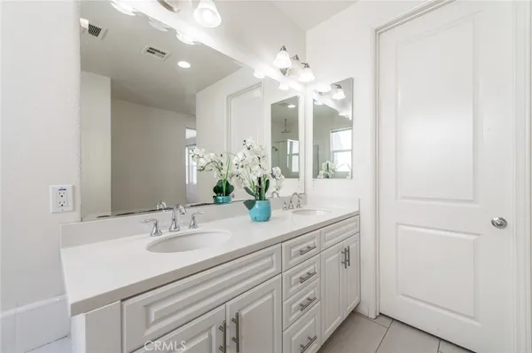 a view of a living room and chandelier