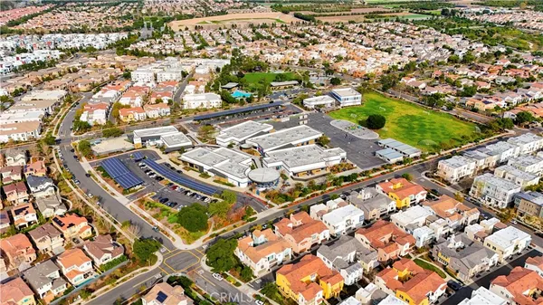 an aerial view of a tennis ground and large trees