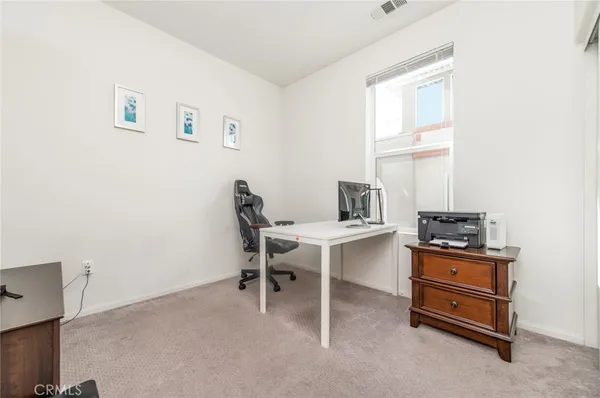 a workspace with furniture and window