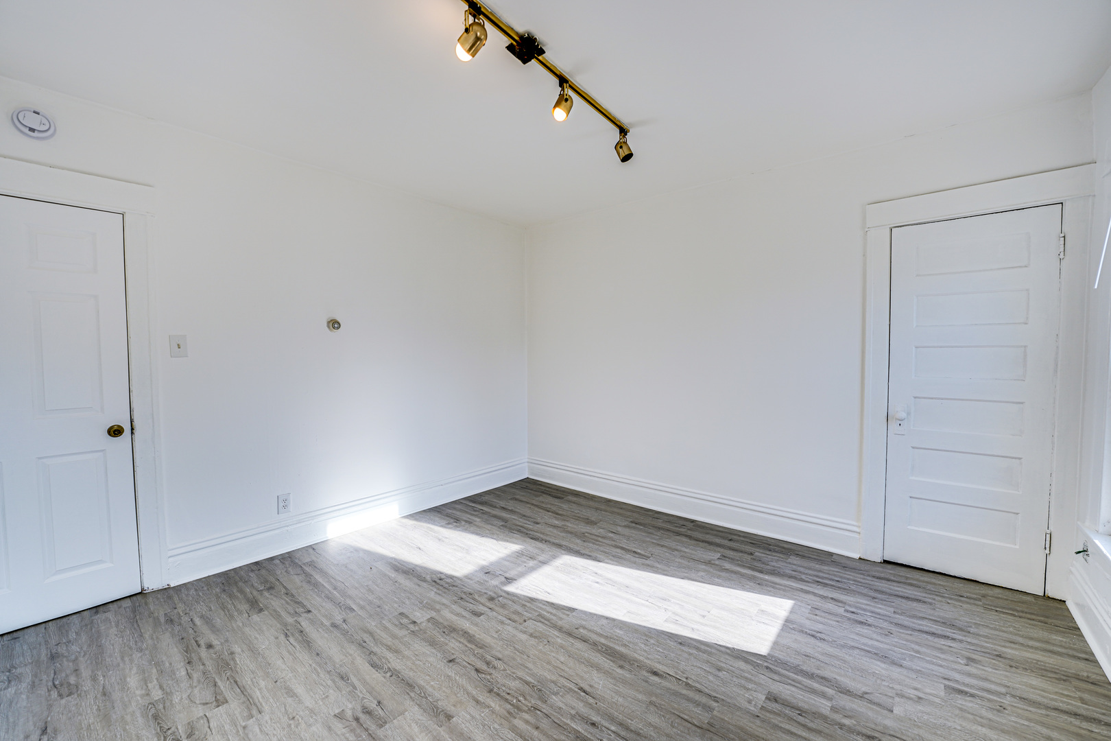 523 Grand Avenue, Unit 2 Aurora, IL 60506 - Photo 10 of 12 wooden floor in an empty room