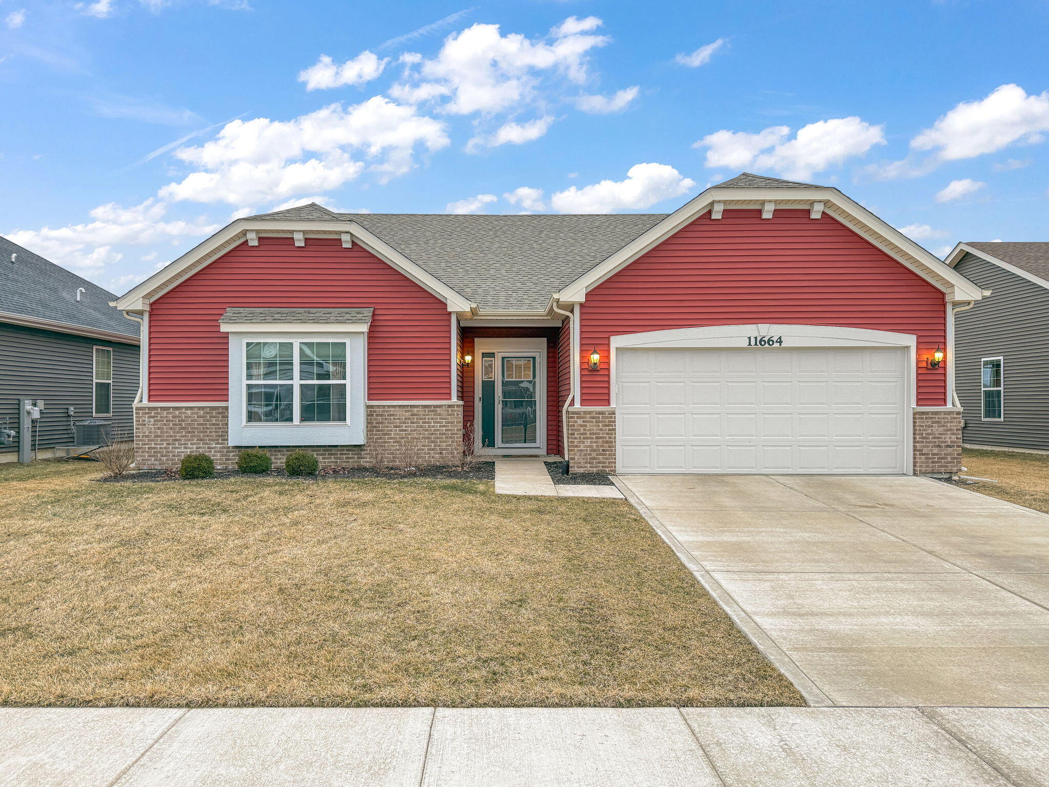 11664 Thomas Street Winfield, IN 46307 - Photo 2 of 30 a front view of a house with yard