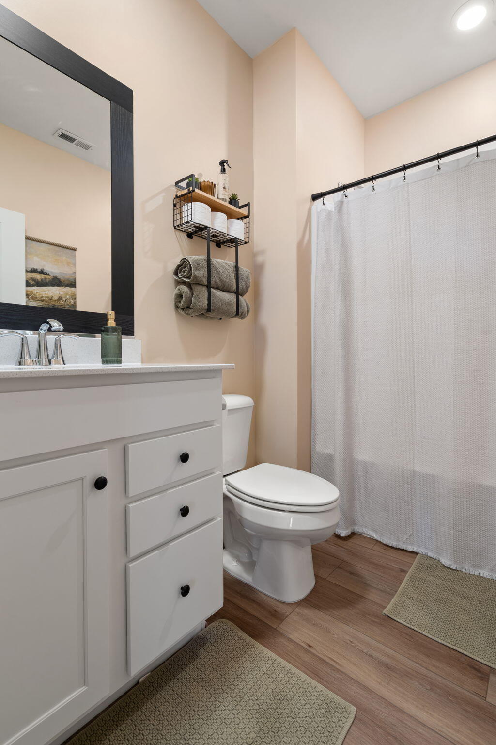 11664 Thomas Street Winfield, IN 46307 - Photo 22 of 30 a bathroom with a toilet a sink and a mirror