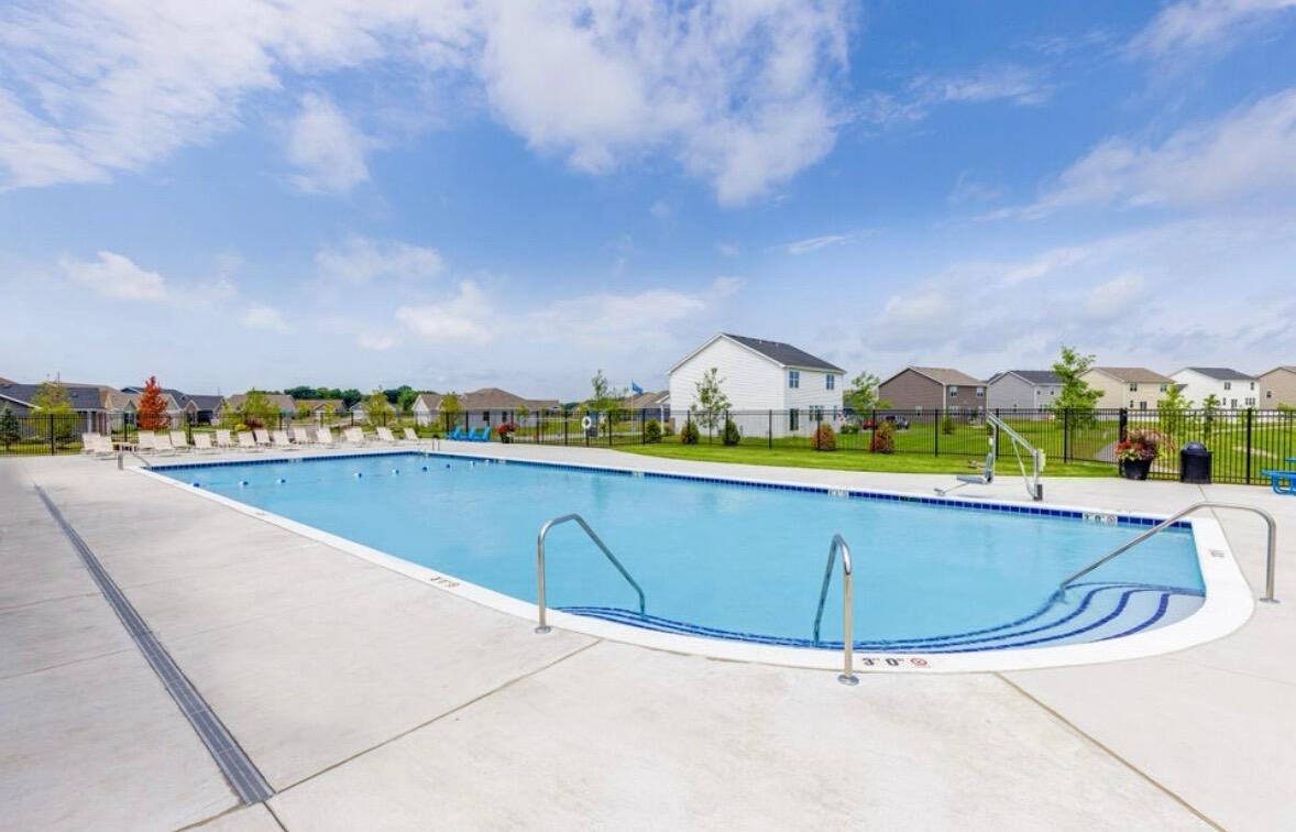 11664 Thomas Street Winfield, IN 46307 - Photo 30 of 30 a view of swimming pool with outdoor seating and city in the back