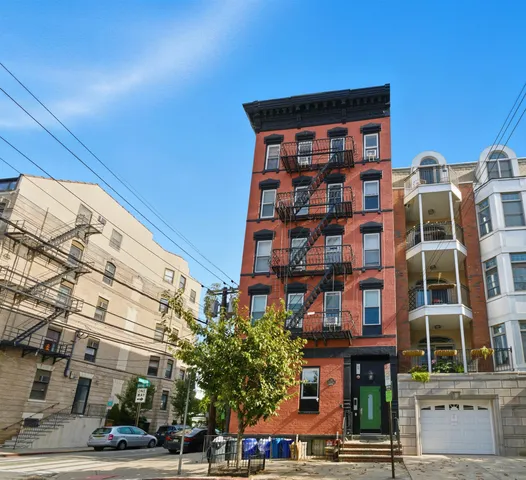 a front view of a building with street view
