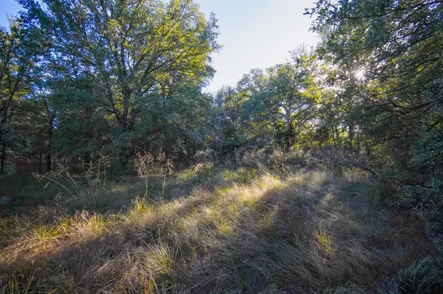 a street sign on a wall next to a building
