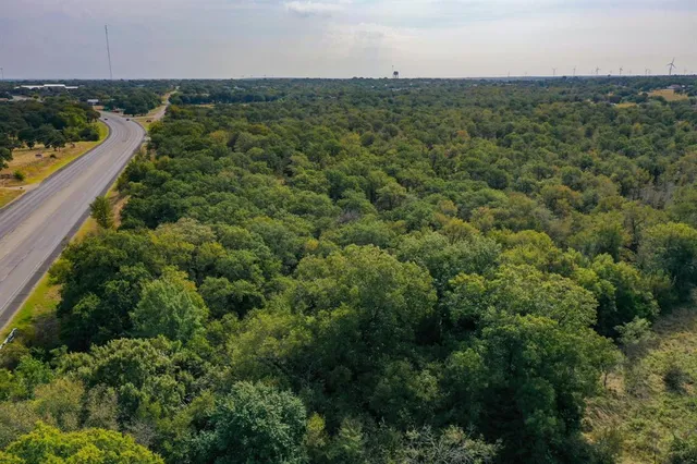 an aerial view of a houses with city view
