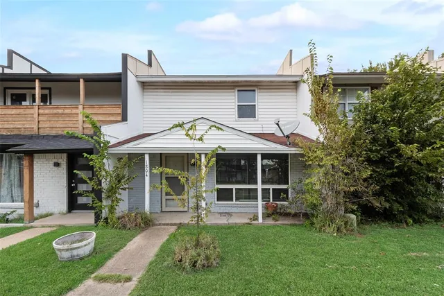 a view of a house with garden and plants