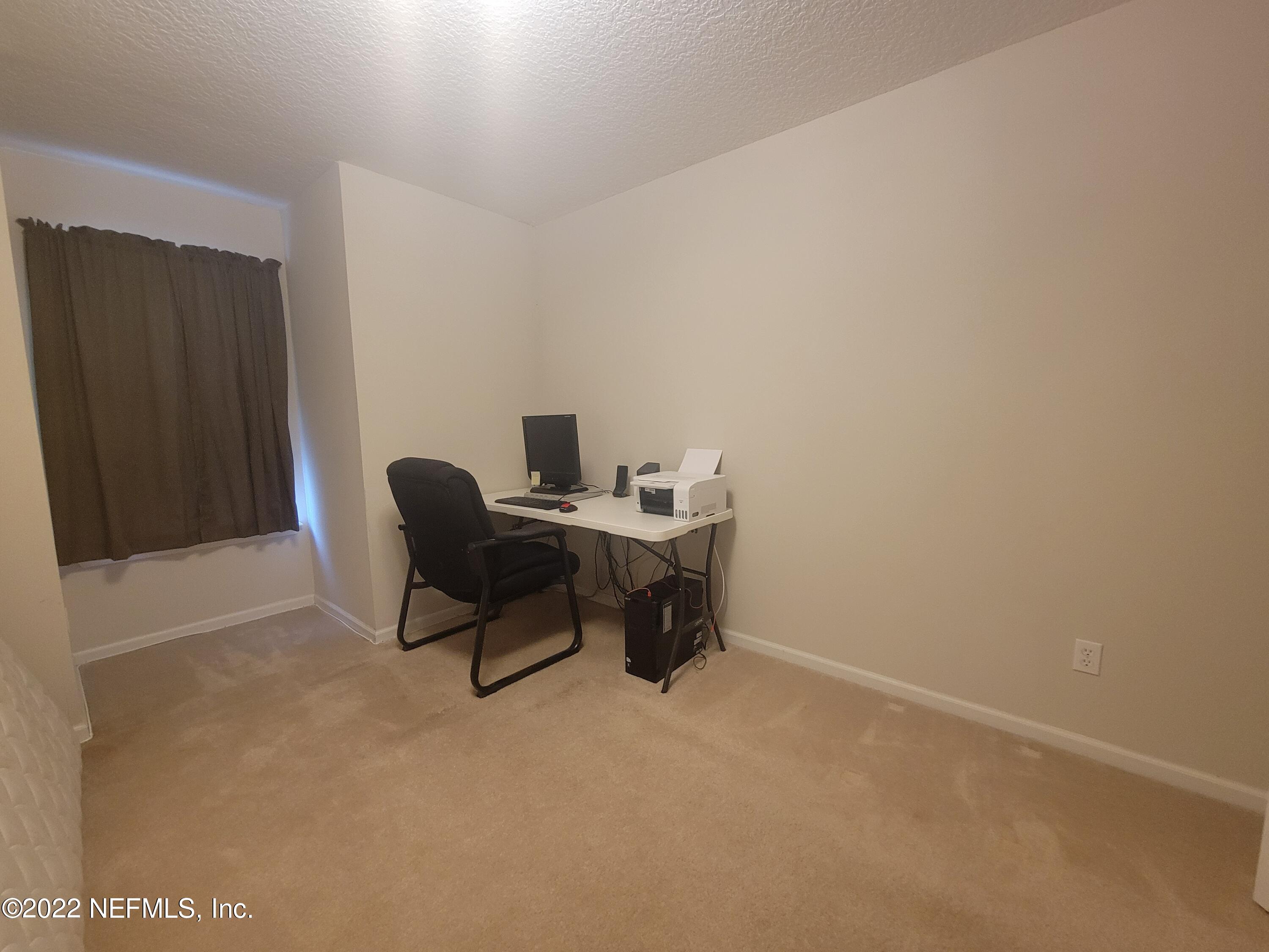 5260 Collins Road, Unit 605 Jacksonville, FL 32244 - Photo 9 of 13 a view of workspace with furniture