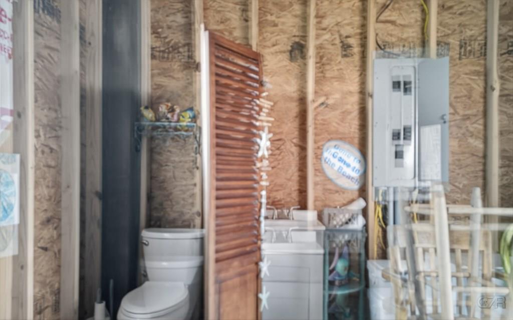 1739 Pompano Lane Crystal Beach, TX 77650 - Photo 14 of 20 a bathroom with a toilet and a shower