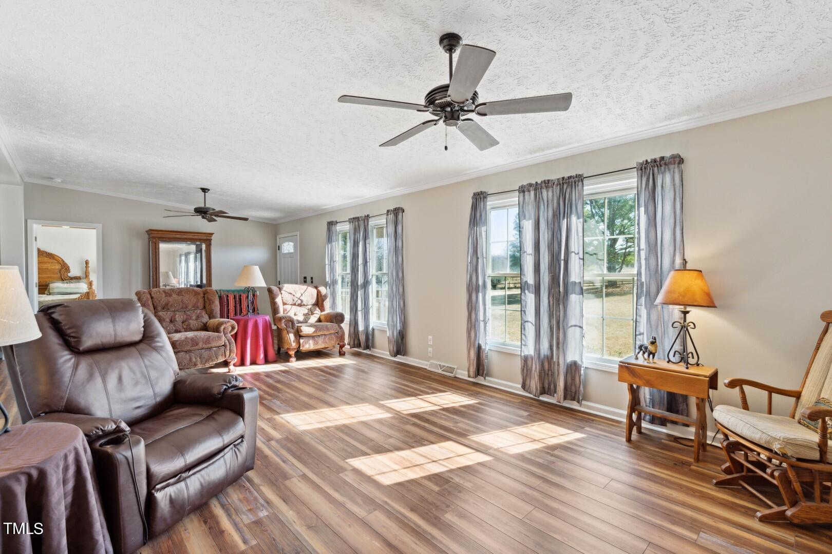 109 Double D Farm Road Angier, NC 27501 - Photo 5 of 42 a bed room with a bed and a chair