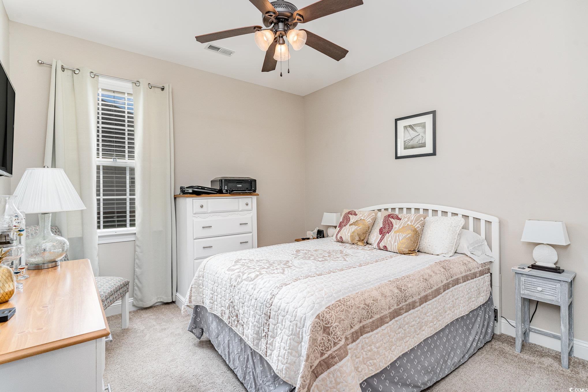 4204 Ridgewood Drive Conway, SC 29526 - Photo 21 of 38 Bedroom with ceiling fan and light colored carpet